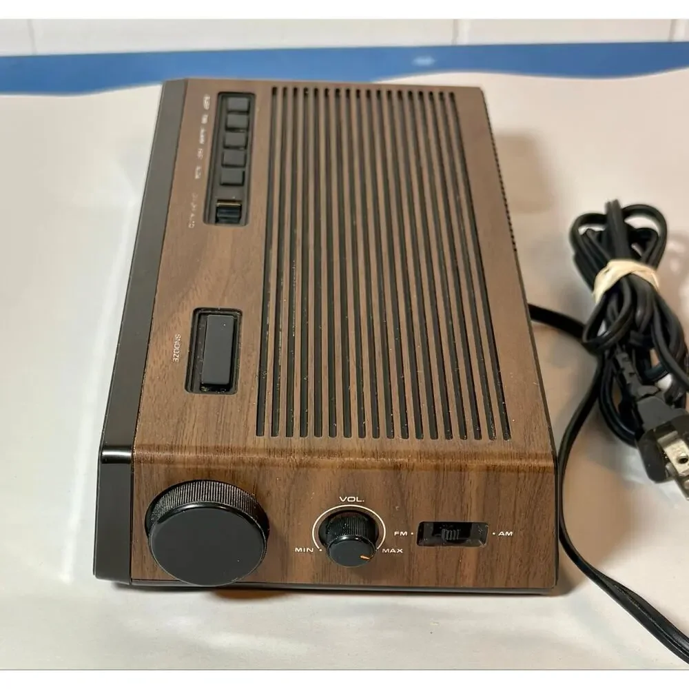 Vintage Lloyds Model J274A Clock Radio Simulated Wood Grain Plastic- clock only